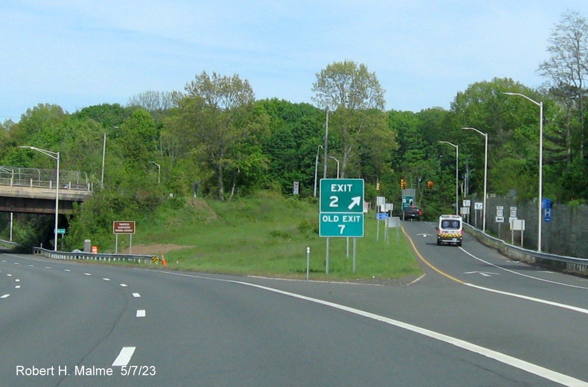 Image of ground mounted 1/2 Mile advance sign for downtown New Britain exit with new milepost based exit number and attached Old Exit 5 sign on CT 72 East in Bristol, May 2023