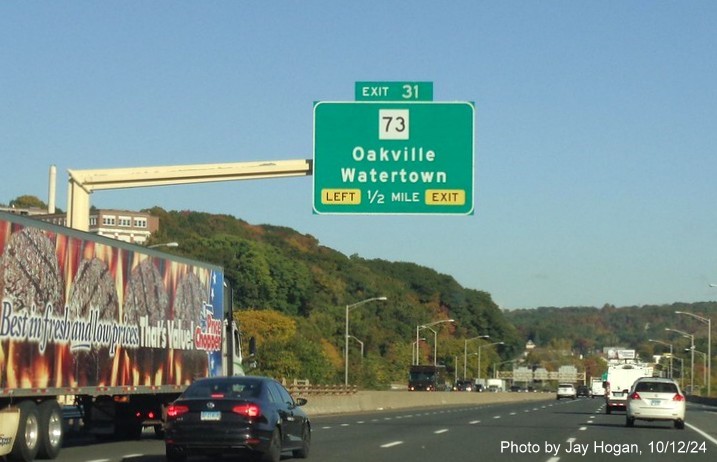 Image of overhead signage for CT 73 exit with new milepost based 
        exit numbers on CT 8 North in Waterbury, by Jay Hogan, October 2024