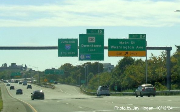 Image of overhead ramp sign for CT 130 exit with new milepost based exit number on CT 8/25 South in Bridgeport, 
                                        Jay Hogan, October 2024