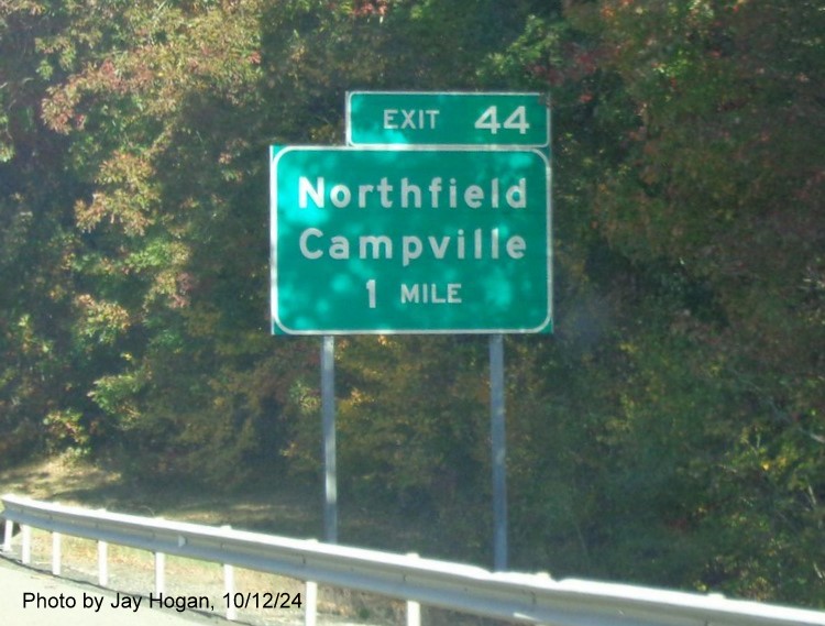 Image of ground mounted 1 mile advance sign for Northfield/Campville exit with new milepost based 
        exit number on CT 8 North in Northfield, by Jay Hogan, October 2024