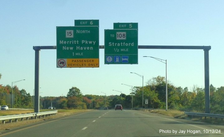 Image of overhead ramp sign for CT 15 North exit with new milepost based exit number on CT 8 
        North in Trumbull, by Jay Hogan, October 2024