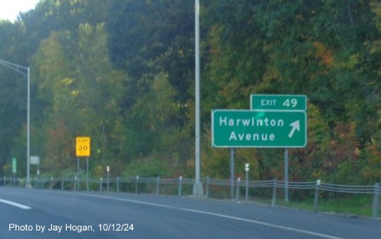 Image of ground mounted ramp sign for Harwinton Avenue exit with new milepost based 
        exit number on CT 8 North in Torrington, by Jay Hogan, October 2024