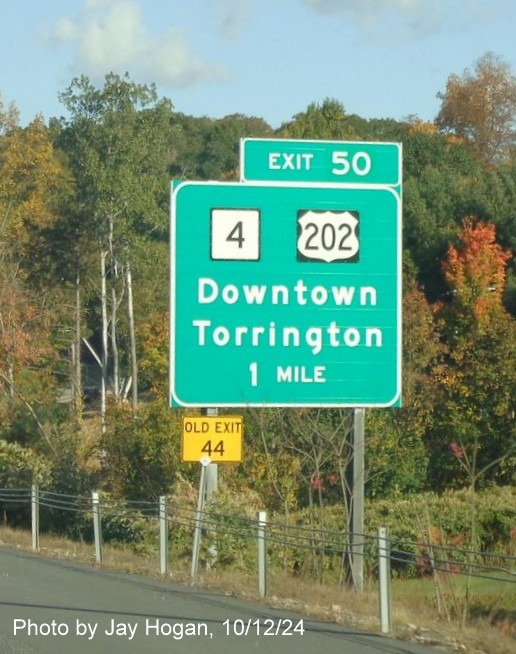 Image of ground mounted 1 mile advance sign for CT 4/US 202 exit with new milepost based 
        exit numbers on CT 8 North in Torrington, by Jay Hogan, October 2024