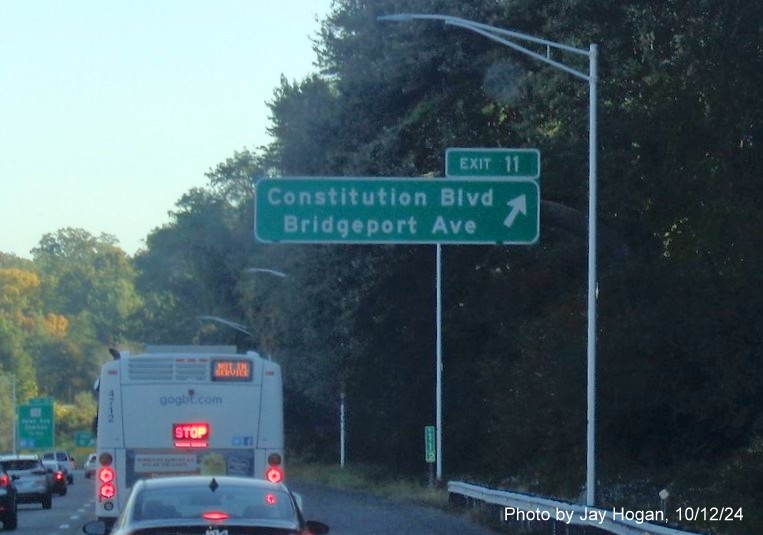 Image of overhead ramp sign for Constitution Blvd exit with new milepost based exit number on CT 8 
        North in Shelton, by Jay Hogan, October 2024