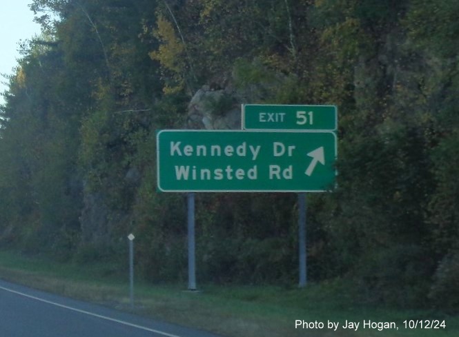 Image of overhead ramp sign for Kennedy Drive/Winsted Road exit with new milepost based 
        exit numbers on CT 8 North in Torrington, by Jay Hogan, October 2024