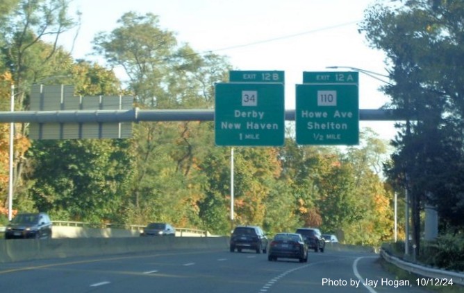 Image of overhead advance signage for CT 34 and CT 110 exits with new milepost based exit numbers on CT 8 
        North in Shelton, by Jay Hogan, October 2024