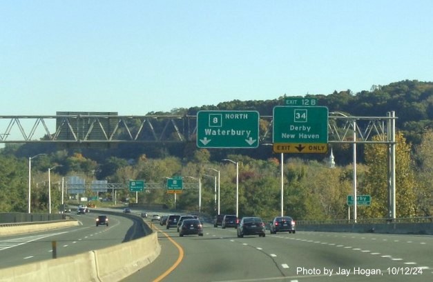 Image of 1/4 Mile advance sign for CT 34 exit with new milepost based exit number on CT 8 
        North in Shelton, by Jay Hogan, October 2024