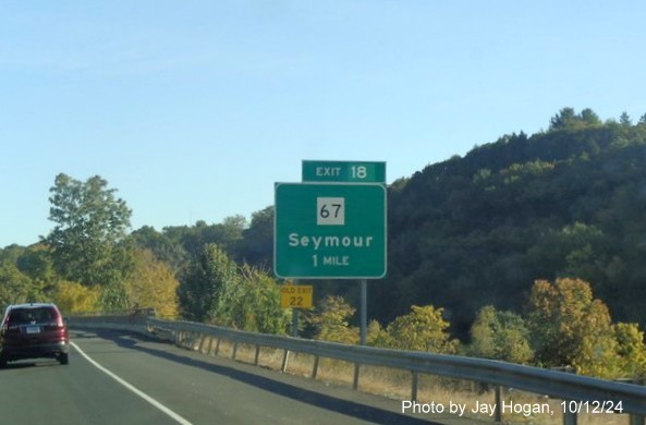 Image of 1 Mile advance sign for CT 67 exit with new milepost based exit number on CT 8 
        North in Seymour, by Jay Hogan, October 2024