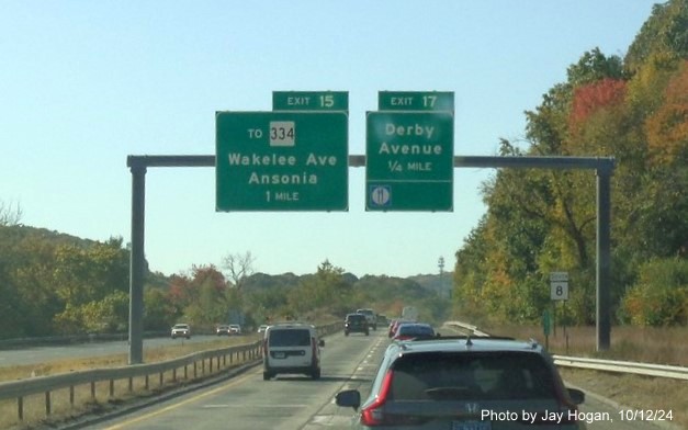 Image of ground mounted ramp sign Derby Avenue exit with new milepost based exit number on CT 8 
        South in Beacon Falls, by Jay Hogan, October 2024