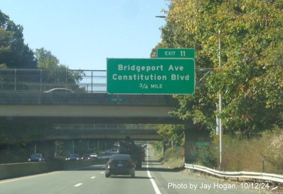 Image of 3/4 Mile advance sign for the Constitution Blvd exit with new milepost based exit number on CT 8 
        South in Shelton, by Jay Hogan, October 2024