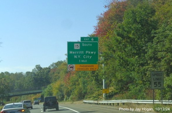 Image of 1 mile advance overhead sign for CT 15/Merrit Parkway South exit with new milepost based exit 
        number on CT 8 South in Trumbull, by Jay Hogan, October 2024