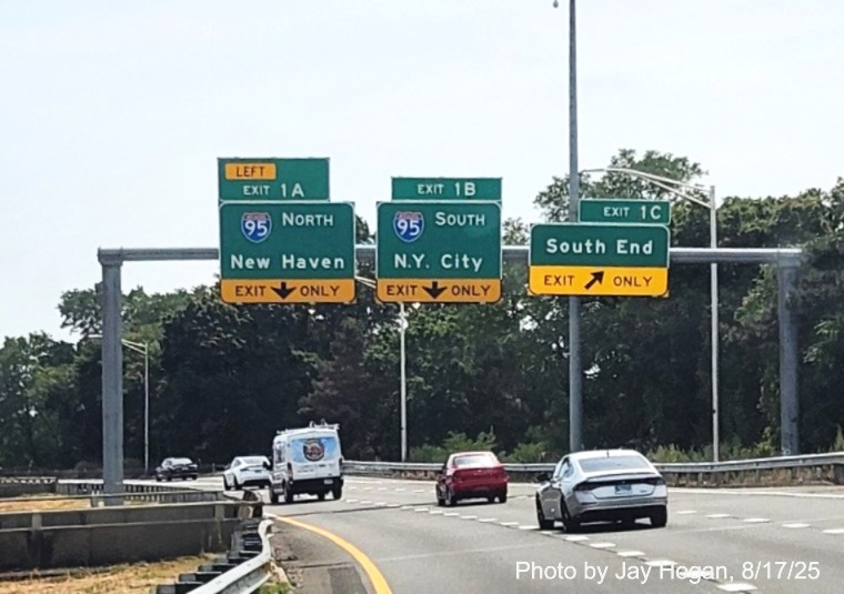 Image of overhead signage at ramp for South End exit with new milepost based exit 
	number tabs for I-95 exits on CT 8/25 South in Bridgeport, by Jay Hogan, August 2025,