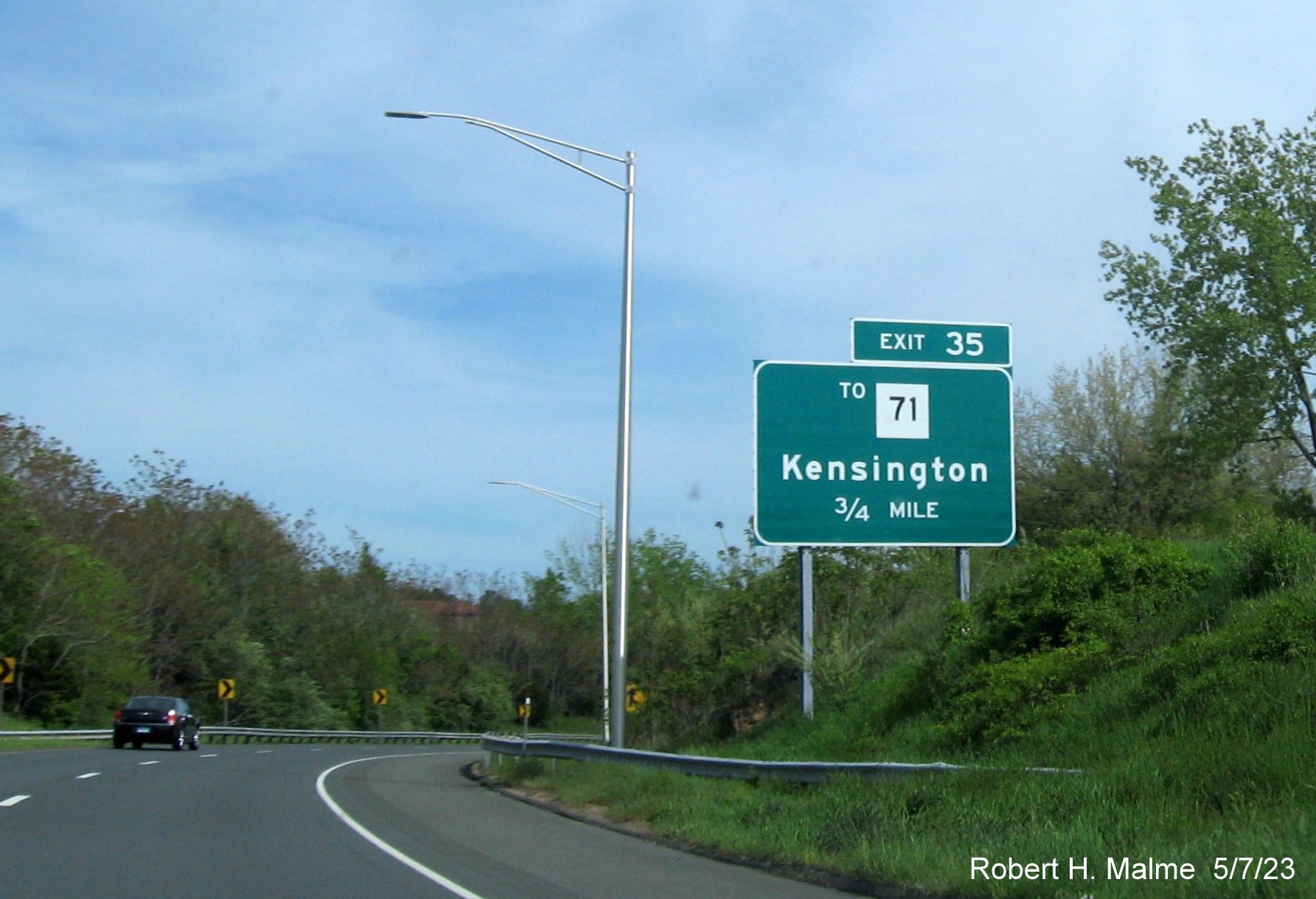 Image of ground mounted 1/2 Mile advance sign for To CT 71 exit with new milepost based exit number on CT 9 South in New Britain, May 2023