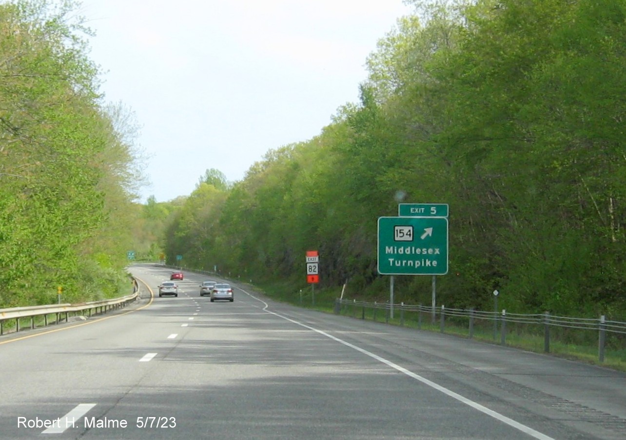 Image of overhead ramp sign for CT 154 exit with new milepost based exit number on CT 9 South in Essex, May 2023