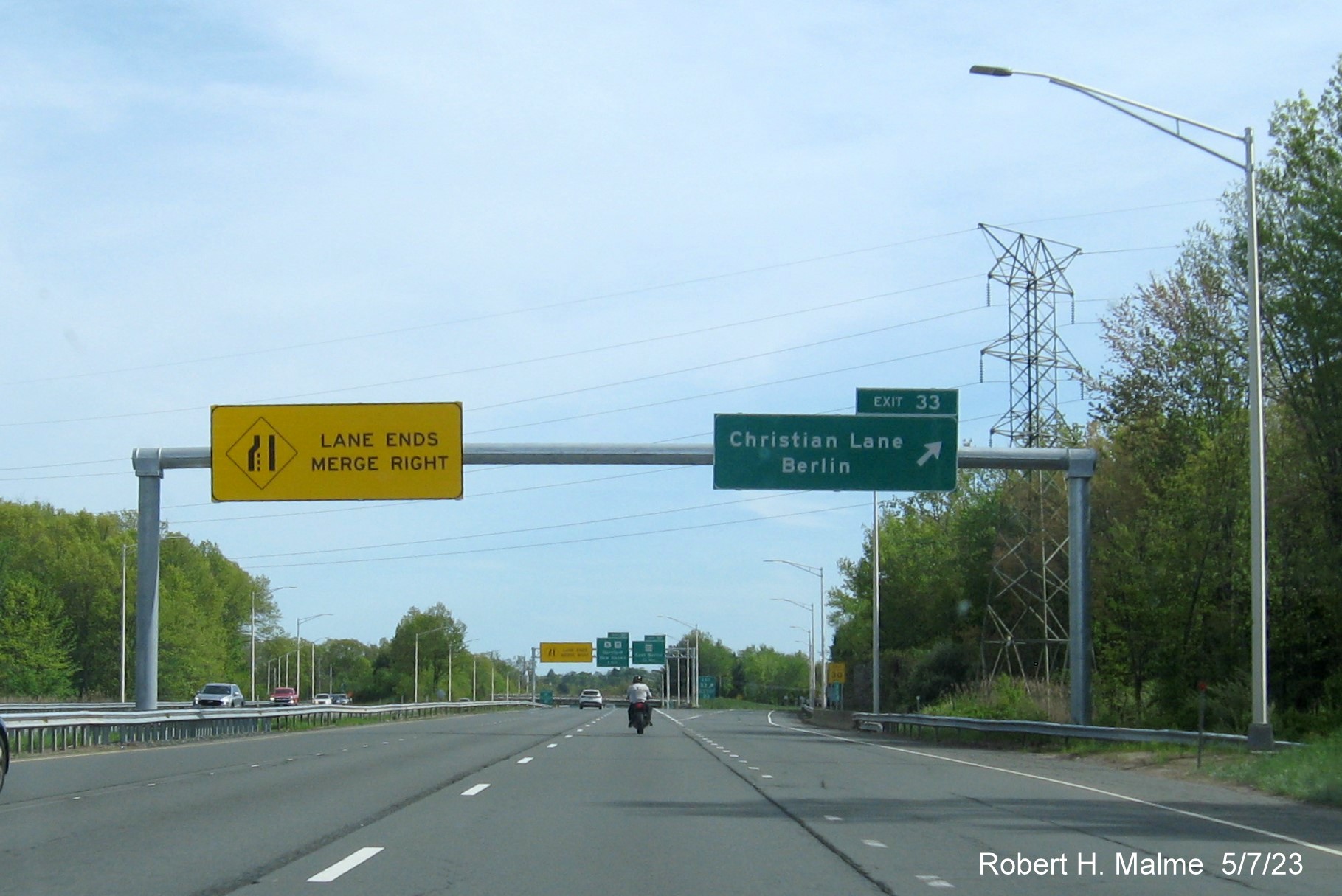 Image of overhead ramp sign for Christian Lane exit with new milepost based exit number on CT 9 South in Berlin, May 2023