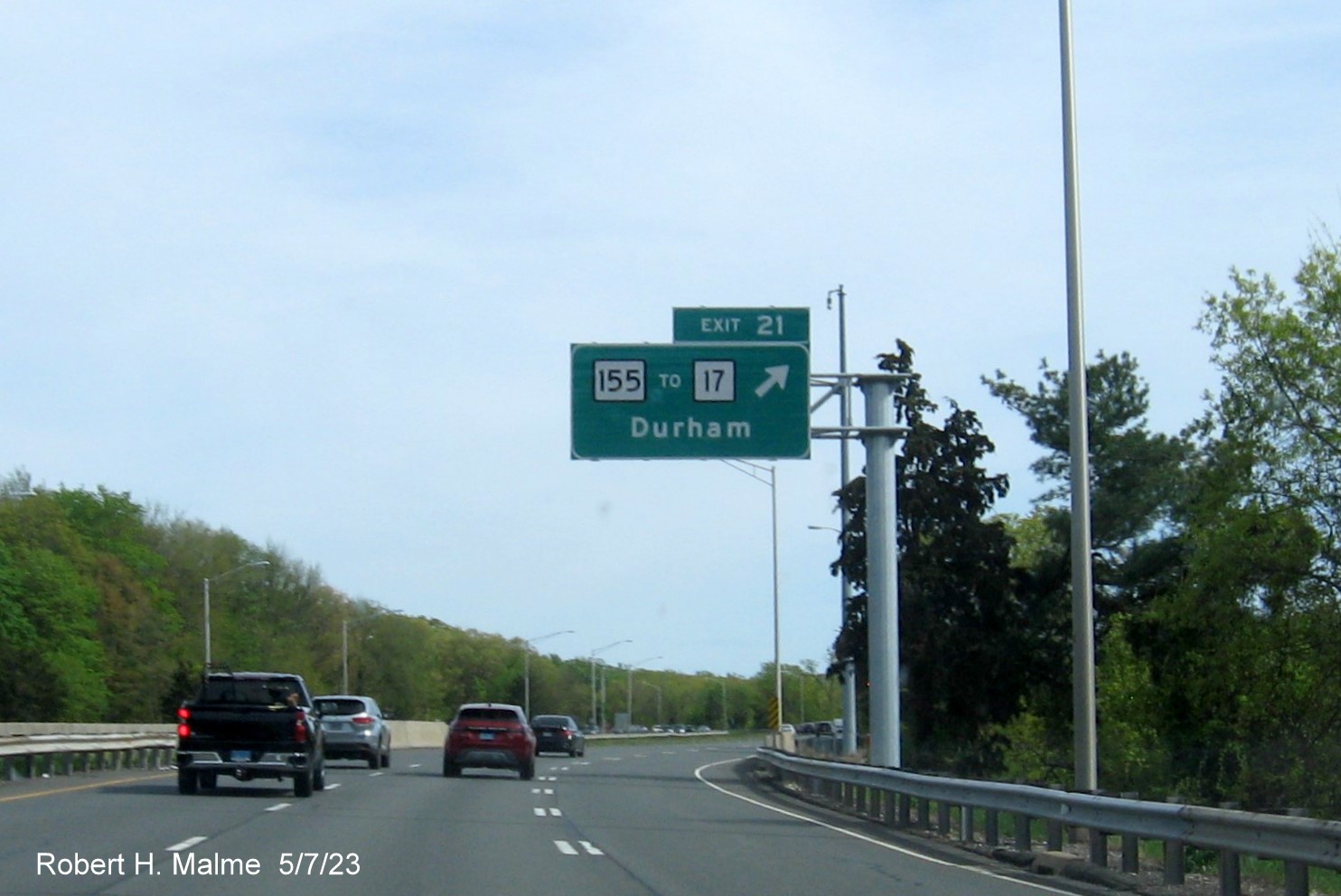 Image of overhead ramp sign for CT 155 exit with new milepost based exit number and Old Exit 11 sign below on CT 9 South in Durham, May 2023