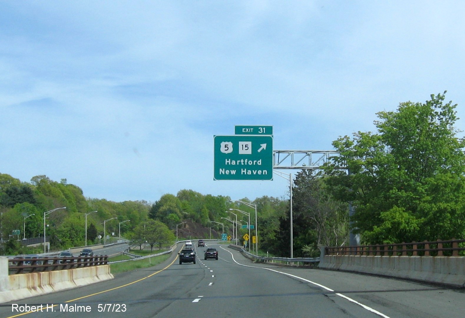 Image of overhead ramp sign US 5/CT 15 exit with new milepost based 
        exit number on CT 9 South in Berlin, May 2023