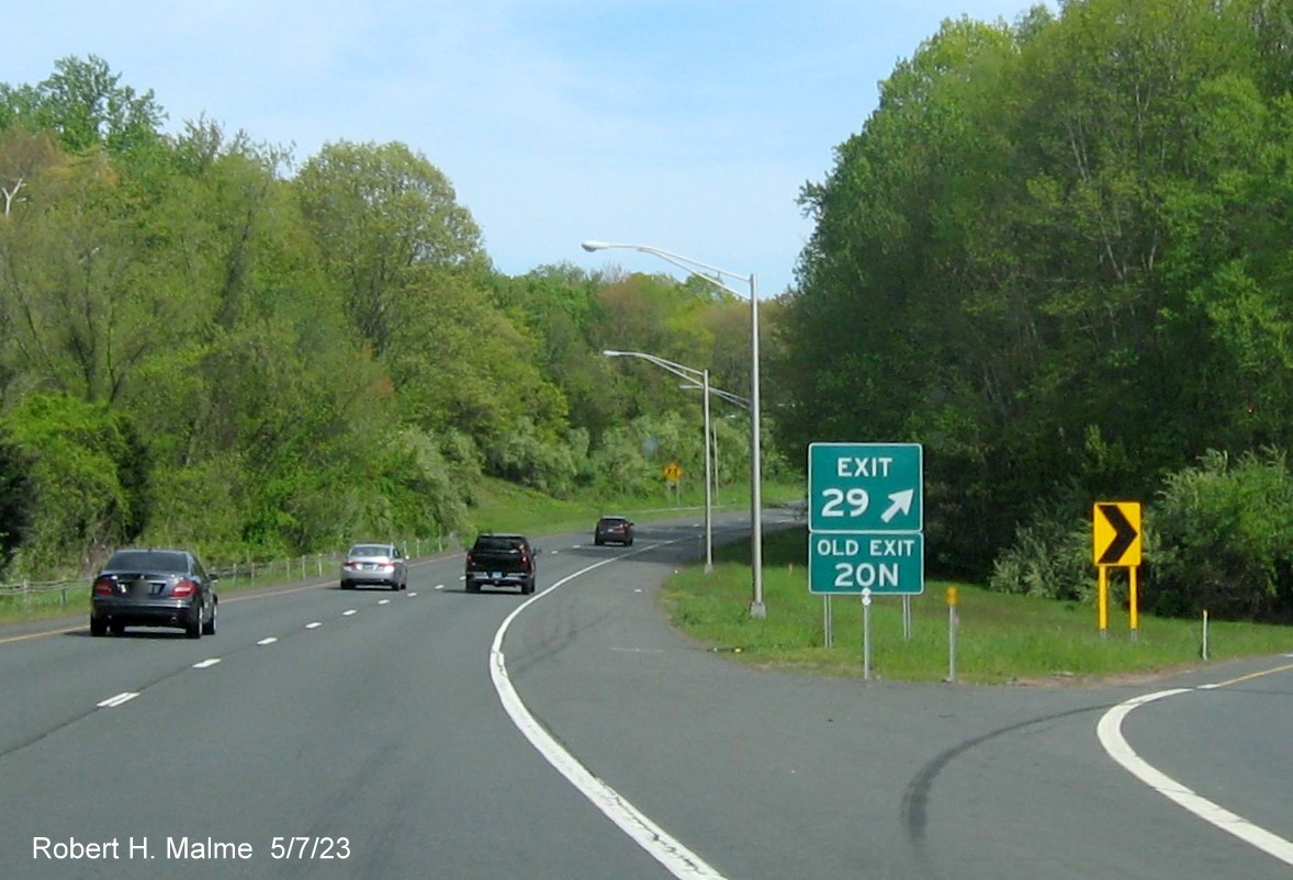 Image of gore sign for I-91 South exit with new milepost based exit number and Old Exit 20N sign below on CT 9 South in Cromwell, May 2023