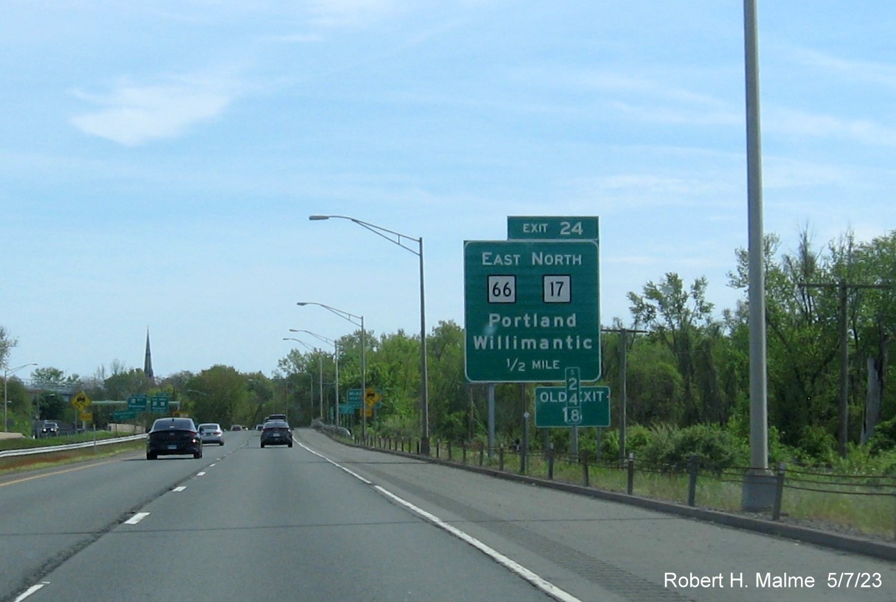 Image of ground mounted 1/2 Mile advance sign for East CT 66/North CT 17 exit with new milepost based exit number and Old Exit 17 sign attached below on CT 9 South in Middletown