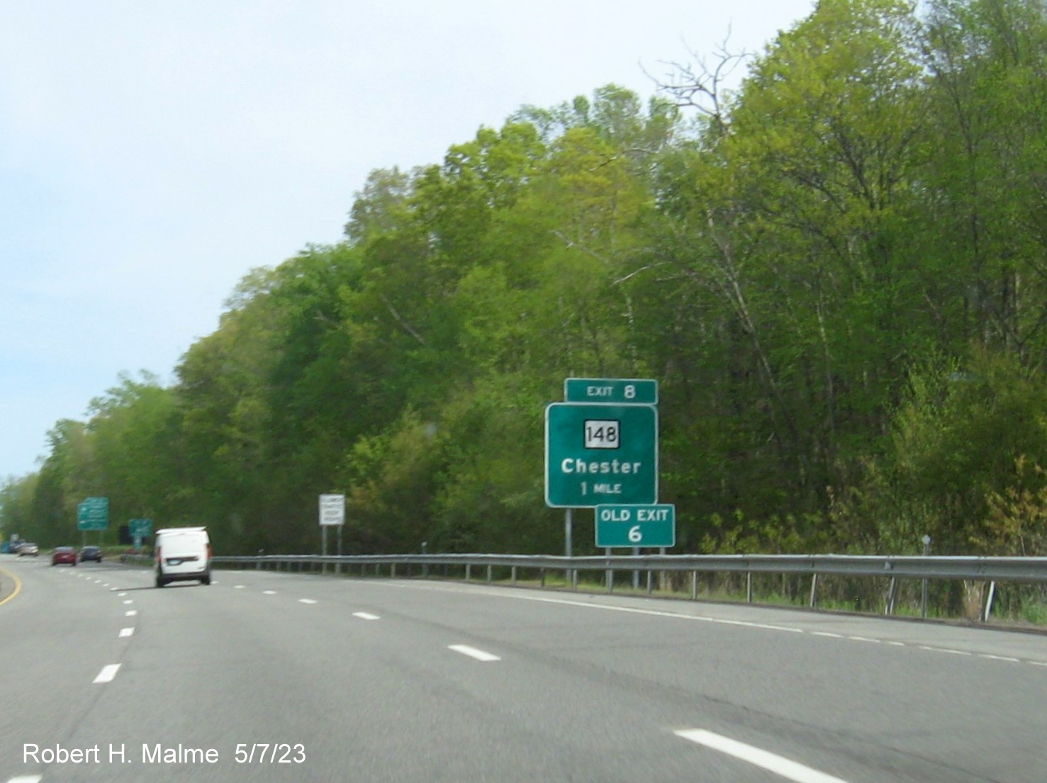 Image of ground mounted 1 Mile advance sign for CT 148 exit with new milepost based exit number and separate Old Exit 6 sign in front on CT 9 South in Chester, May 2023