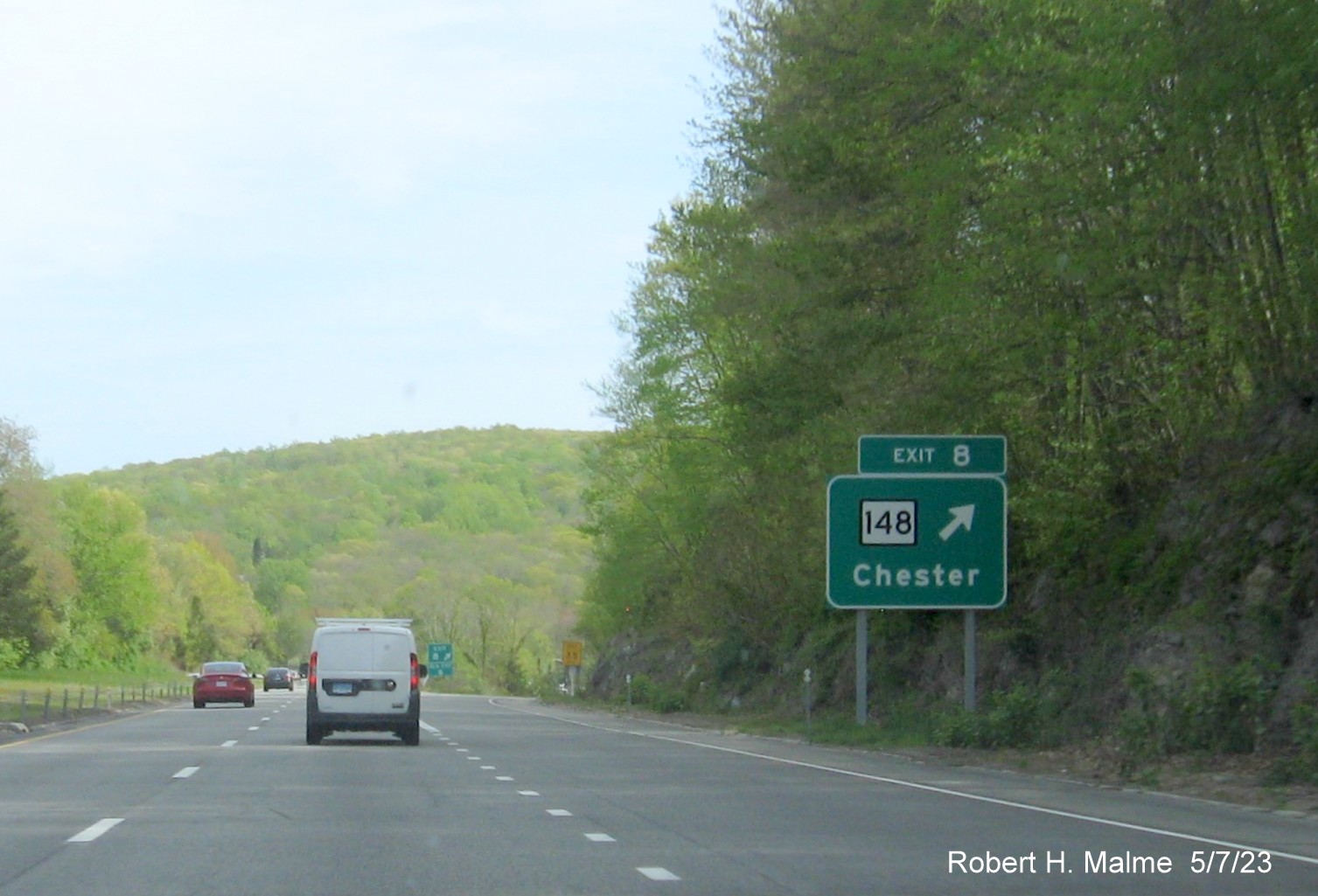 Image of ground mounted ramp sign for CT 148 exit with new milepost based exit number on CT 9 South in Chester, May 2023