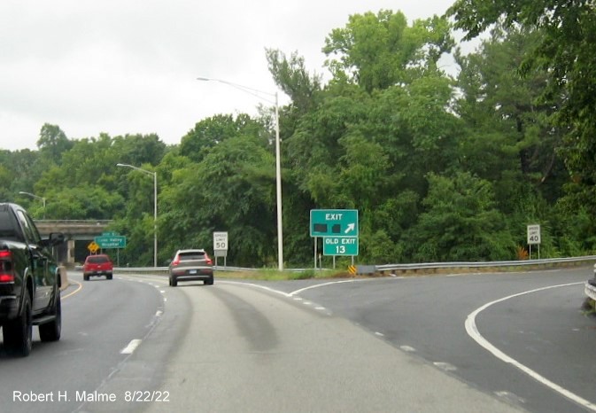 Image of gore sign for CT 17 South exit with new Old Exit sign below but covered future milepost based number 23A on sign on CT 9 South in Middletown, August 2022