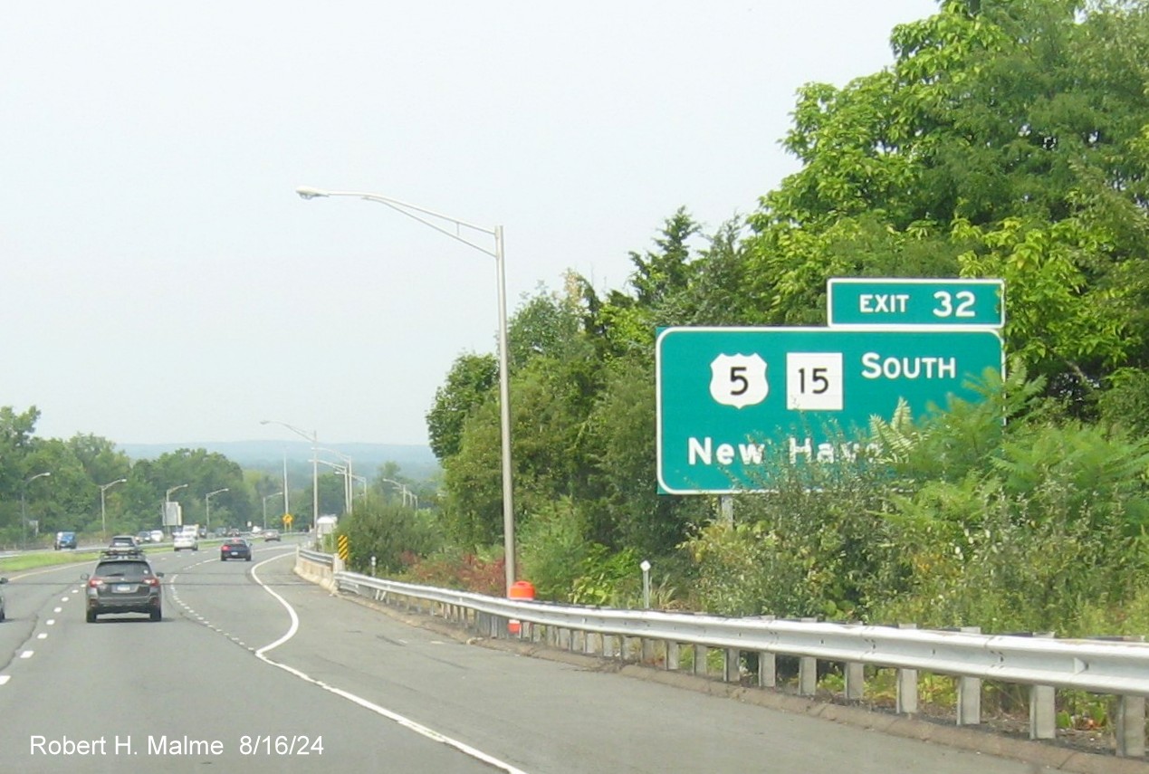 Image of ground mounted ramp sign for US 5/CT 15 South exit with new milepost based exit number  
       on CT 9 North in East Berlin, August 2024