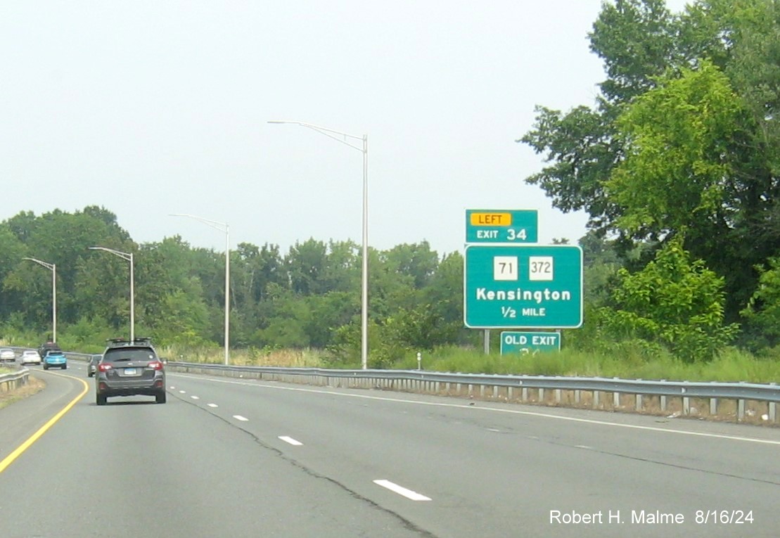 Image of 1 mile advance sign for US 5/CT 15 South exit with new milepost based exit number and 
      separate New and Old Exit signs in front on CT 9 North in Berlin, August 2024