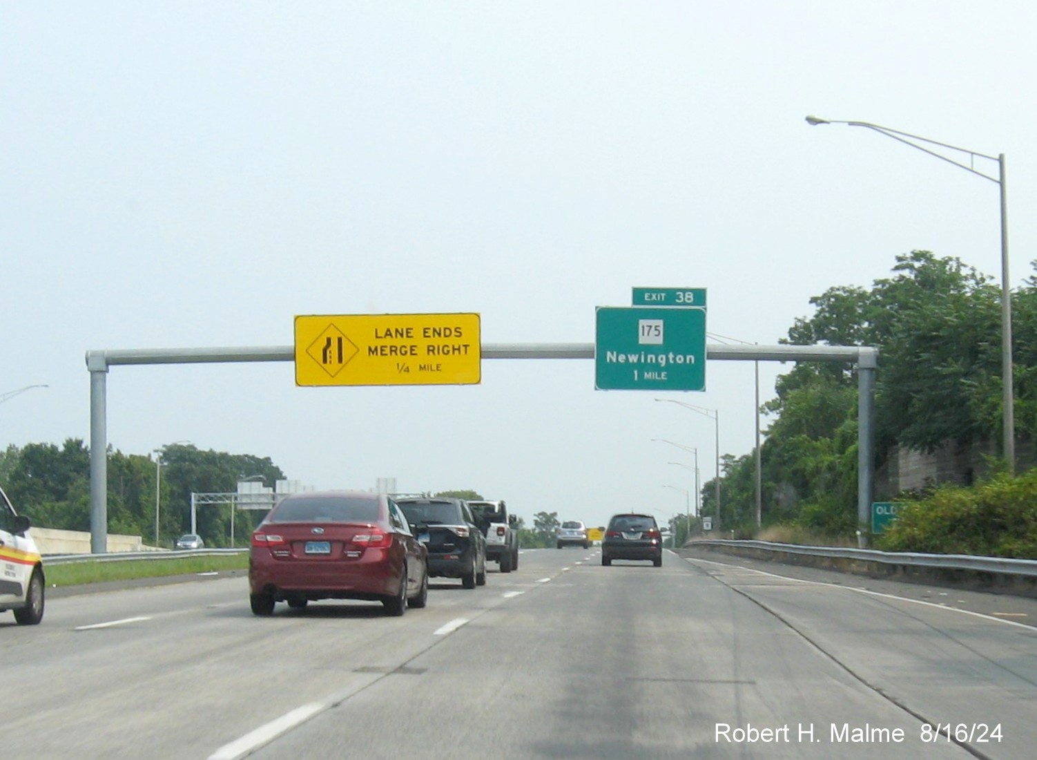 Image of 1 mile advance overhead sign for CT 175 exit with new milepost based exit number and 
      separate Old Exit sign in front, but hidden by vegetation on CT 9 North in Newington, August 2024