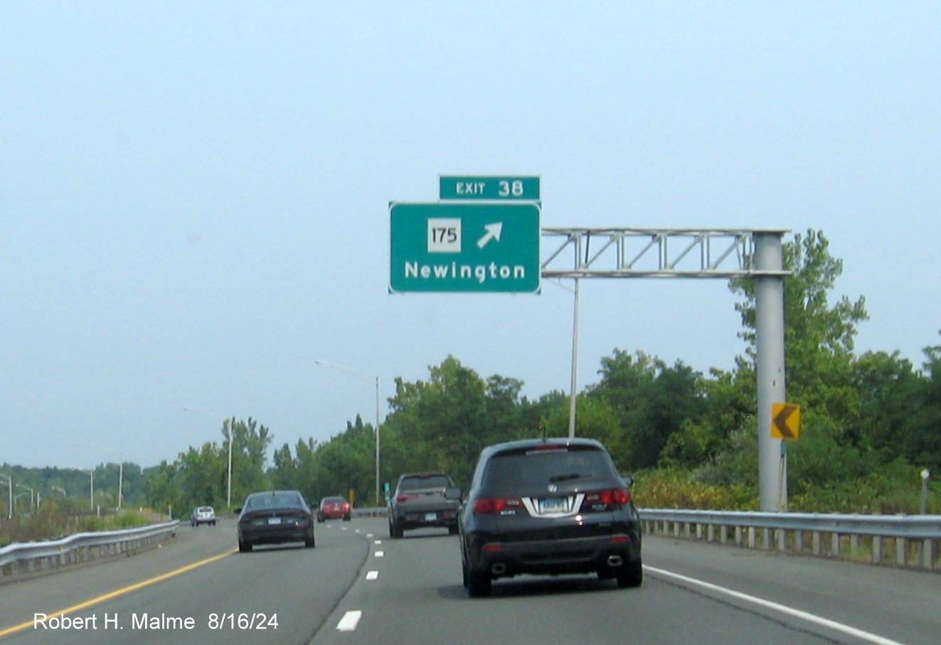 Image of overhead ramp sign for CT 71 exit with new milepost based exit number on CT 9 North in 
      Newington, August 2024