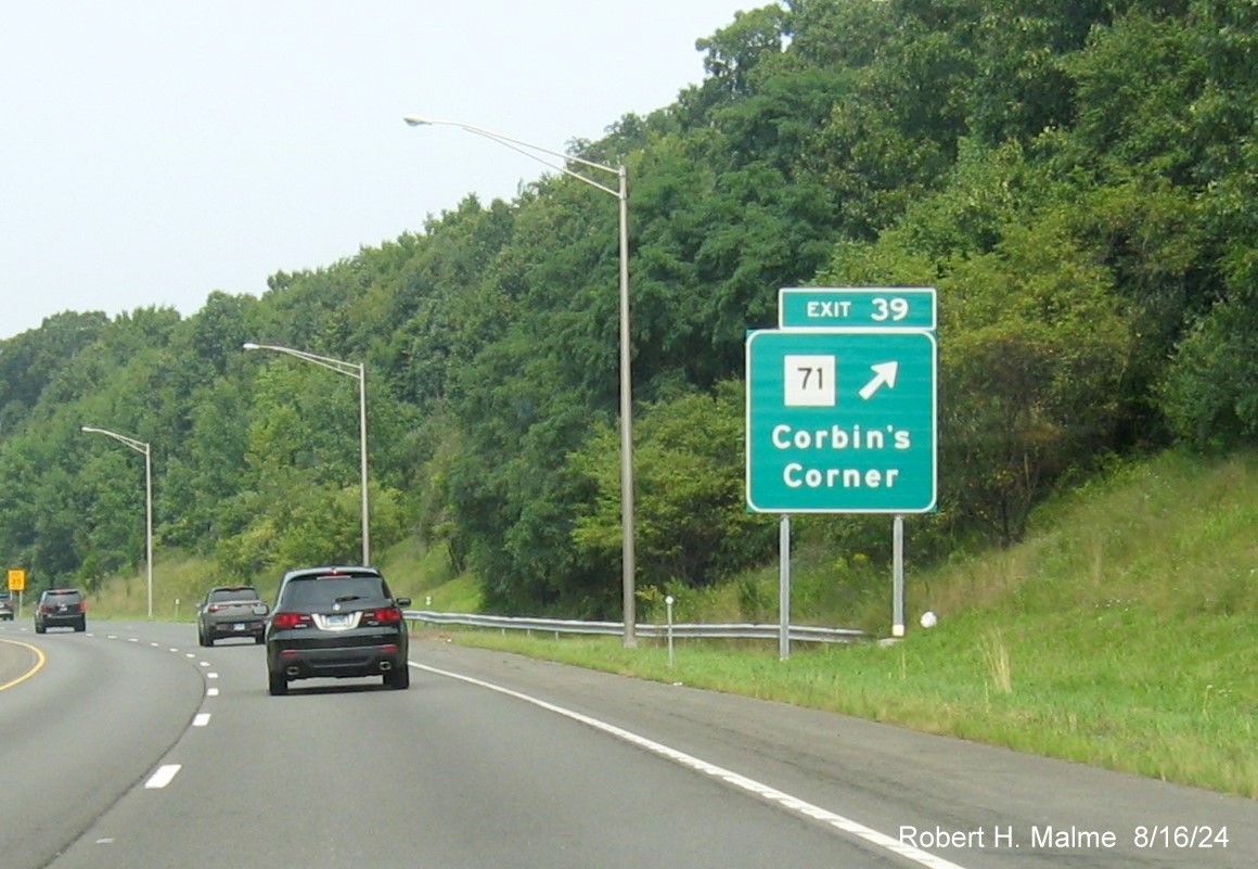 Image of 1 mile advance overhead sign for CT 175 exit with new milepost based exit number and 
      separate Old Exit sign in front, but hidden by vegetation on CT 9 North in Newington, August 2024