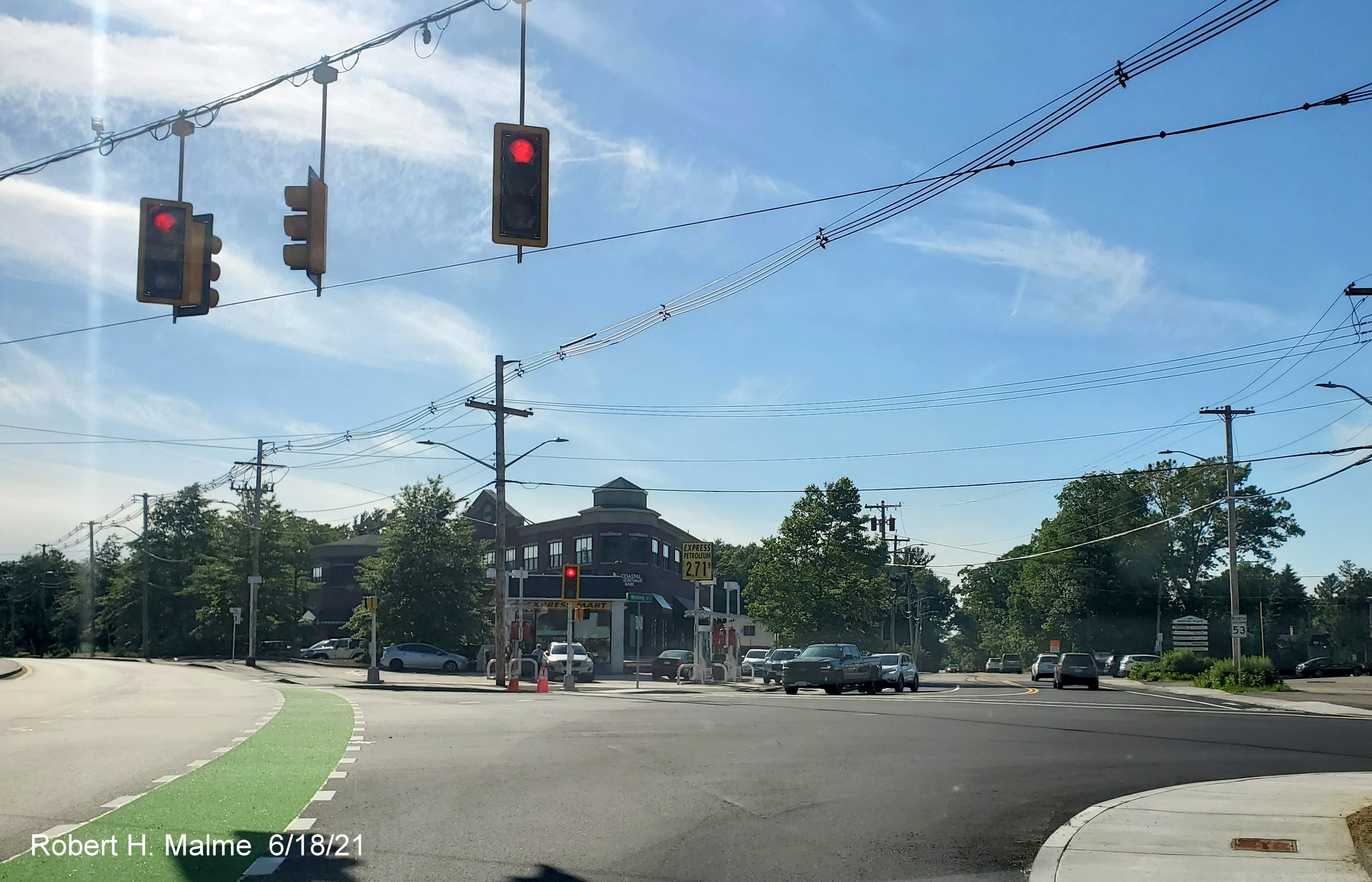 Image of completed renovation of Whiting Street (MA 53) intersection with Derby and Gardner Streets in Hingham including new traffic signals, a painted bicyle lane and new North MA 53 reassurance marker, June 2021