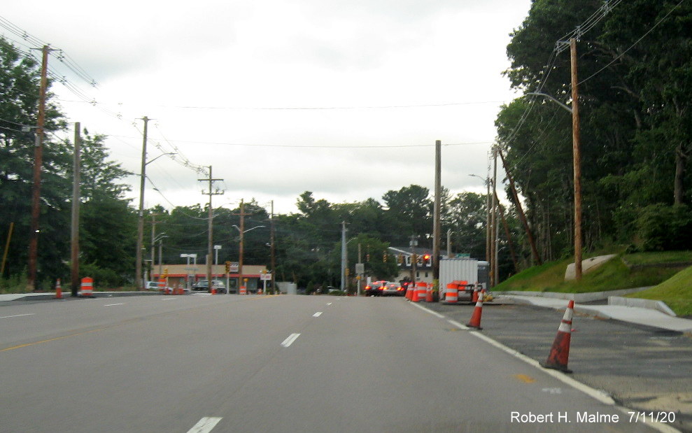 Image of construction equipment and utility poles still in southern side of widened Derby Street right-of-way as of mid-July 2020