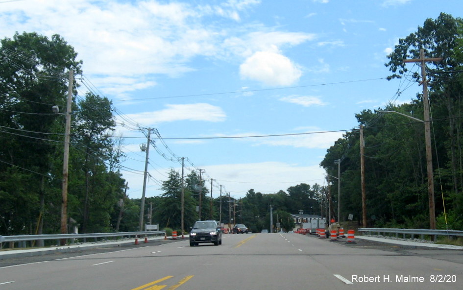 Image of view looking east on Derby Street showing remaining utility poles removed from widened roadway right-of-way, August 2020