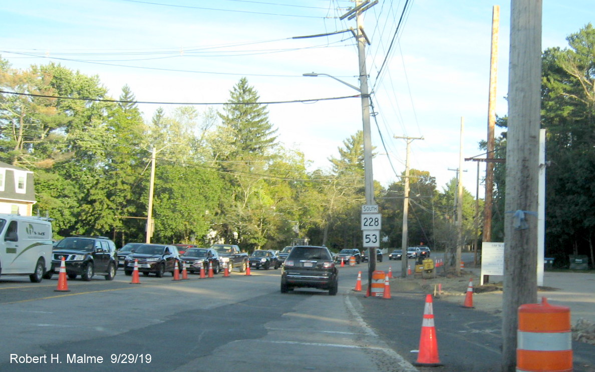 Image of MA 228 and MA 53 shields placed back in Derby Street construction zone on telephone pole in late September 2019