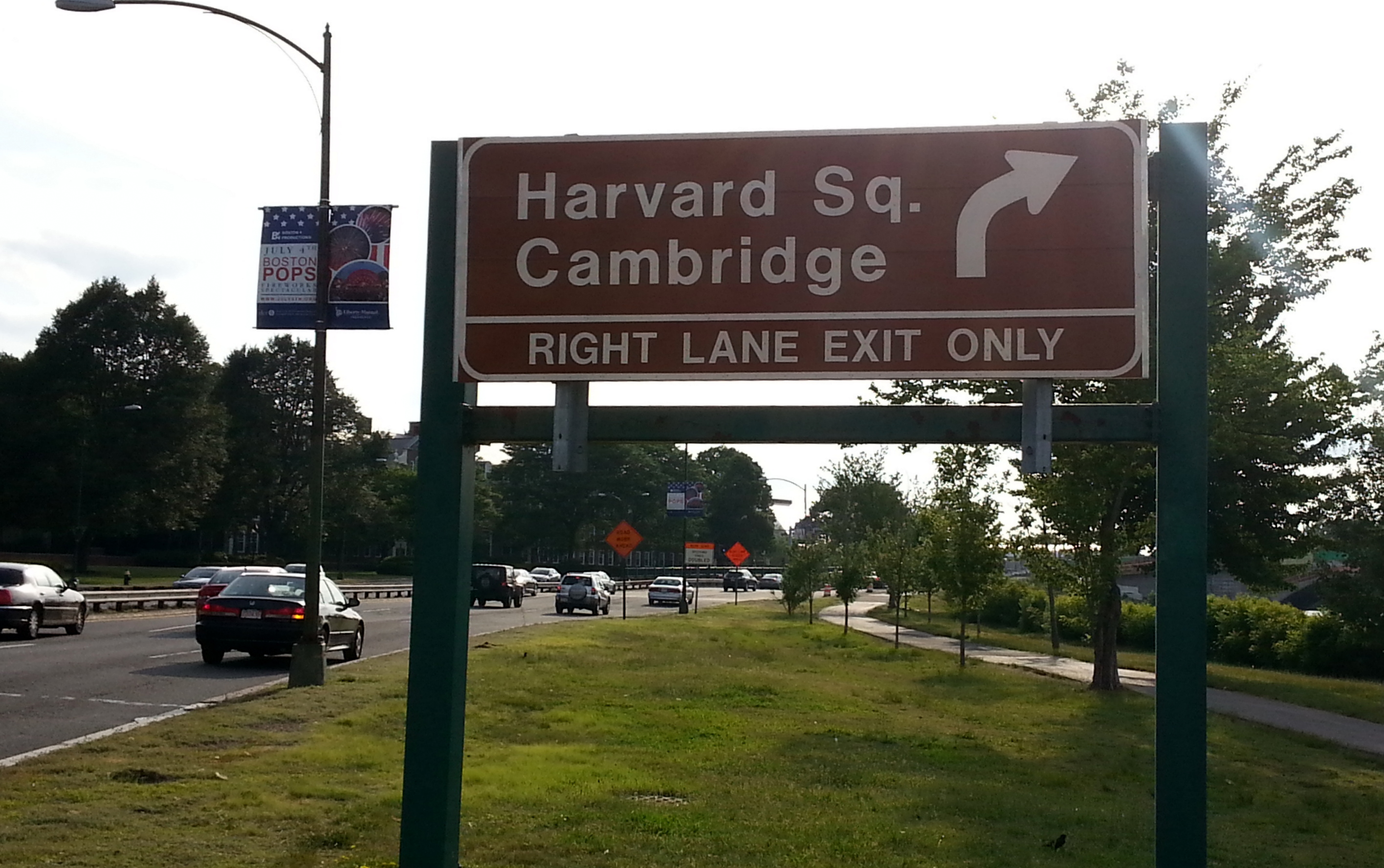 New brown exit sign for Harvard Square on Soldiers Field Rd in Boston