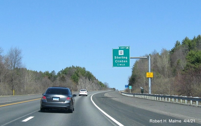 Image of 1 Mile advance sign for MA 12 exit with new milepost based exit number and yellow Old Exit 6 advisory sign on support on I-190 North in Sterling, April 2021