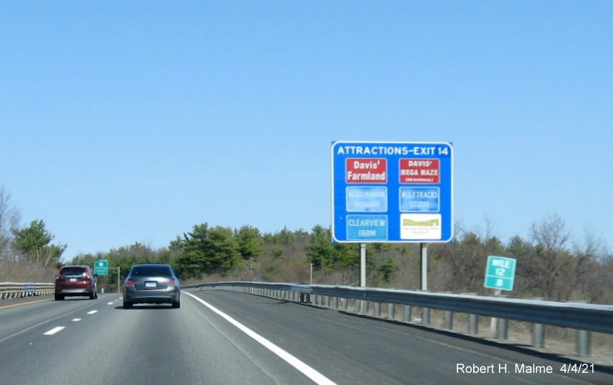 Image of blue Attractions Services sign for MA 12 exit with new milepost based exit number on I-190 North in Sterling, April 2021