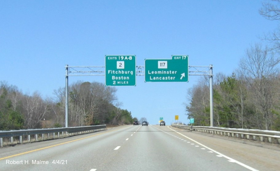 Image of overhead signage at ramp to MA 117 exit with new milepost based exit numbers on I-190 North in Leominster, April 2021