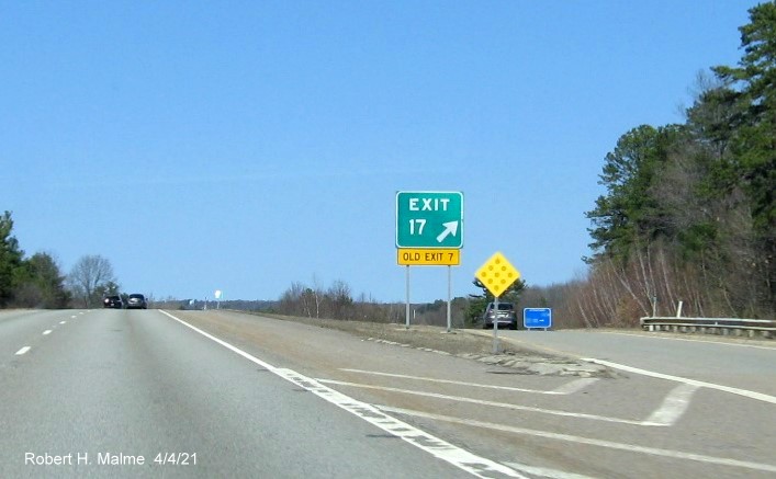 Image of gore sign for MA 117 exit with new milepost based exit number and yellow Old Exit 7 sign attached below on I-190 North in Leominster, April 2021