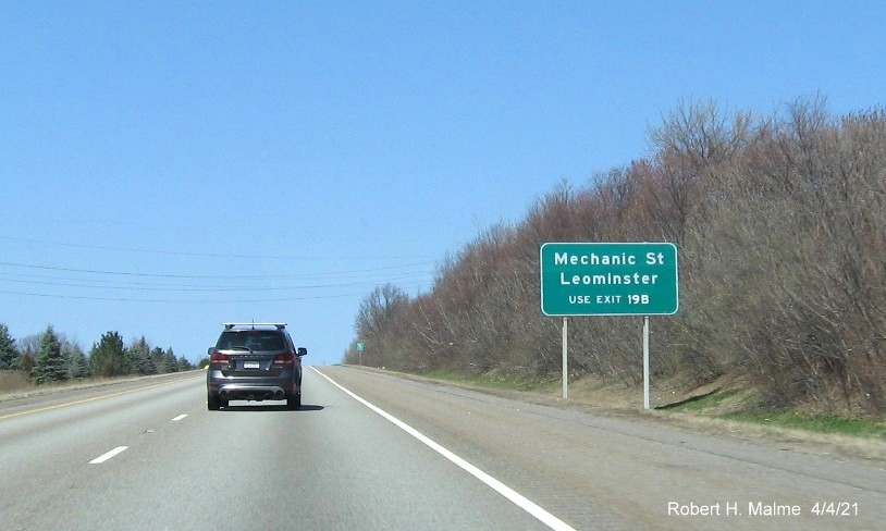 Image of auxiliary sign for MA 2 exit with new milepost based exit number on I-190 North in Leominster, April 2021