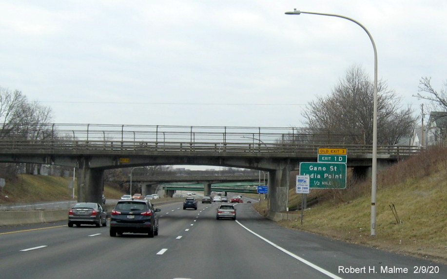Image of ground mounted 1/2 Mile advance sign for Gano Street with new milepost based exit number and yellow old exit tab on I-195 West in East Providence