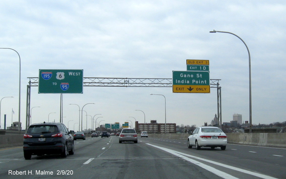 Image of overhead 1/4 mile advance sign for Gano Street exit with new milepost based exit number and yellow old exit tab on I-195 West in East Providence