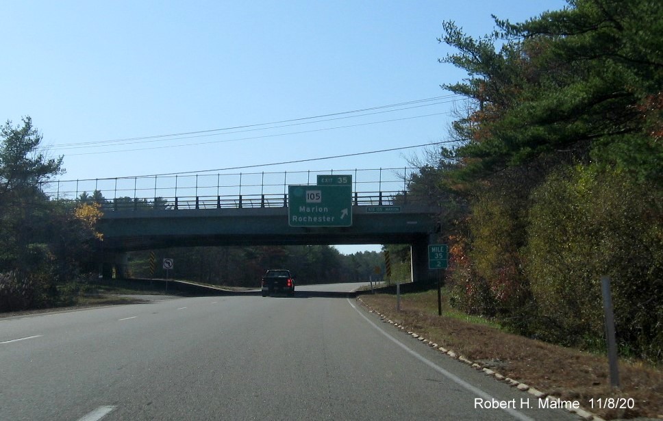Image of bridge mounted exit sign for MA 105 with new milepost based exit number on I-195 West in Marion, November 2020