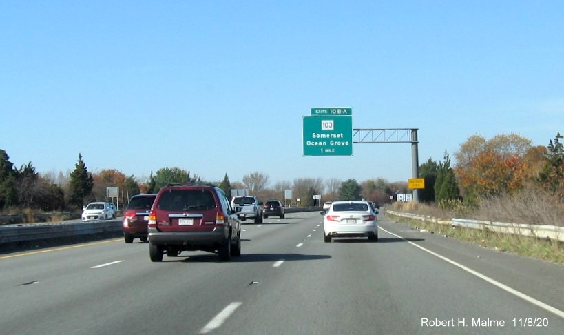 Image of 1-mile advance sign for MA 103 exit with new milepost based exit number and yellow old exit number sign on support post on I-195 West in Somerset, November 2020