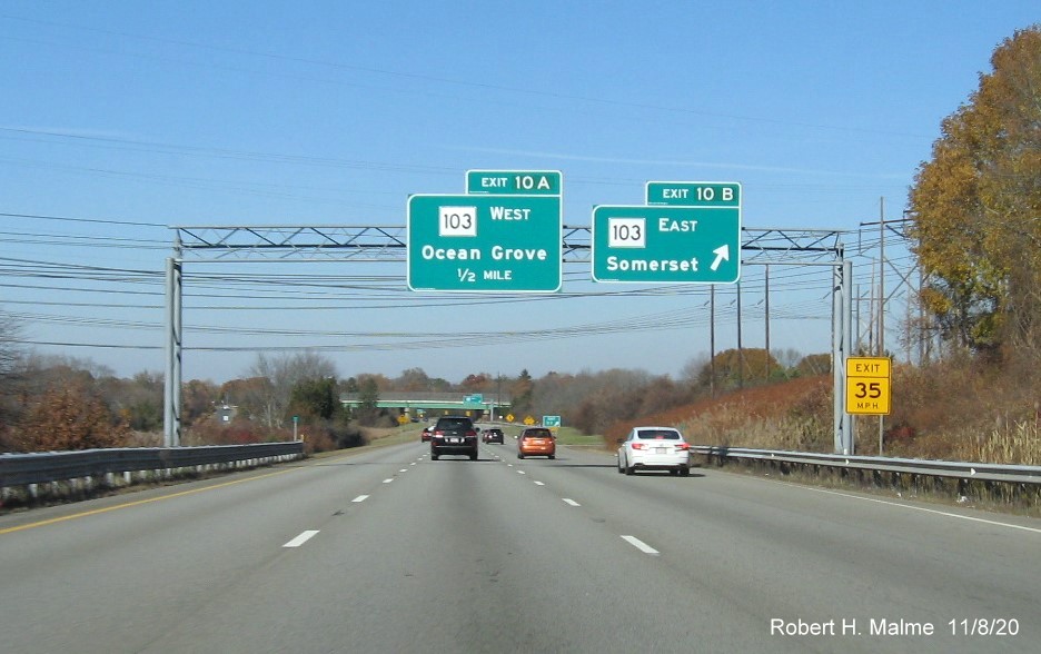 Image of overhead signage at ramp to MA 103 North with new milepost based exit numbers on I-195 West in Somerset, November 2020