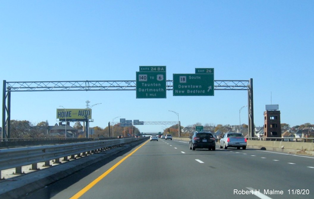 Image of overhead signs at the exit ramp to MA 18 South with new milepost based exit numbers on I-195 West in New Bedford, November 2020