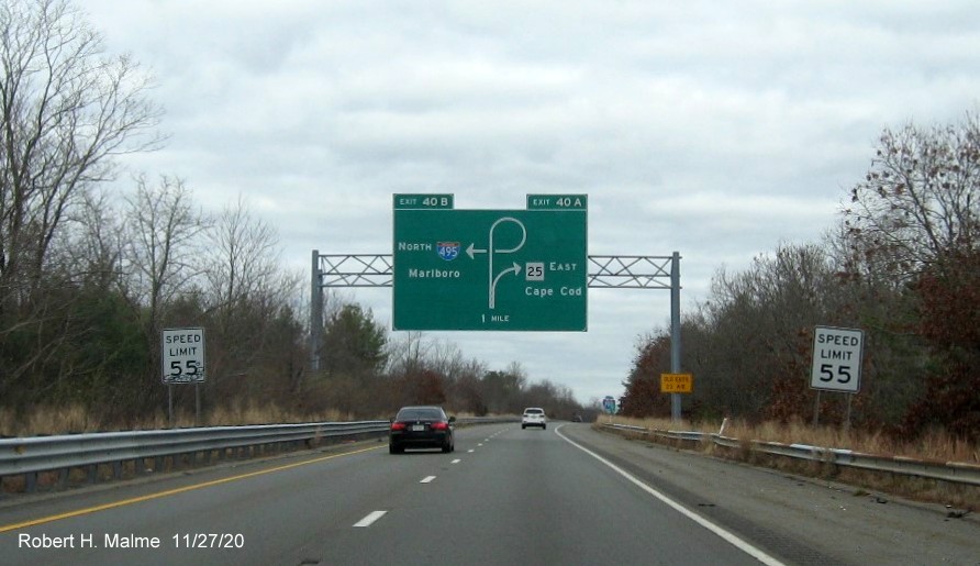 Image of 1-mile advance diagrammatic sign for the I-495 North/MA 25 East exit with new milepost based exit number and yellow old exit numbers sign on support post on I-195 East in Wareham, November 2020