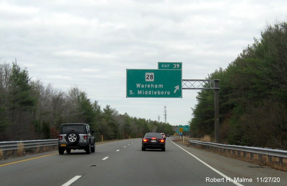 Image of overhead ramp sign for MA 28 exit with new milepost based exit number on I-195 East in Wareham, November 2020