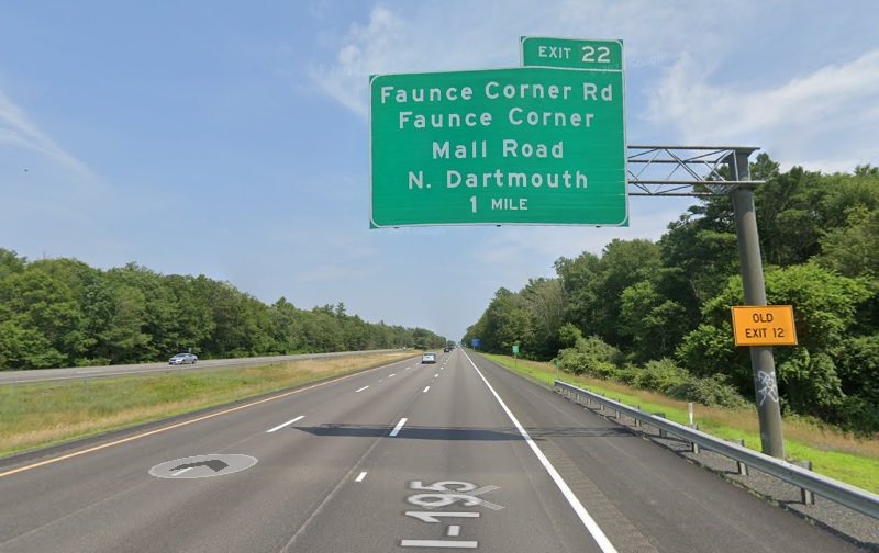 Google Maps Street View image of 1 mile advance overhead sign for Faunce Corner Rd/Faunce Corner Mall Road exit with new milepost based exit number and yellow Old Exit 12 advisory sign on support on I-195 East in Dartmouth, July 2021